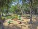 Community playground featuring slides, swings, and seesaw at 7246 Bucks Ford Dr, Riverview, FL 33578