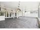 Large screened-in porch with tiled floors and decorative lighting at 7246 Bucks Ford Dr, Riverview, FL 33578