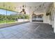 Spacious screened-in porch with tiled floors and decorative lighting at 7246 Bucks Ford Dr, Riverview, FL 33578