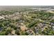 Extensive aerial perspective displaying a vibrant residential area, surrounded by mature trees and local buildings at 7703 N Branch Ave, Tampa, FL 33604