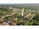 Aerial view of a charming neighborhood surrounded by trees, highlighting the community's peaceful setting at 7703 N Branch Ave, Tampa, FL 33604