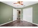 Bedroom with ceiling fan and closet and view to another room at 7703 N Branch Ave, Tampa, FL 33604