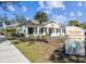 Exterior of The Oaks at Riverview clubhouse, featuring lush landscaping and signage at 7703 N Branch Ave, Tampa, FL 33604