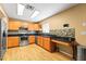 Well-lit kitchen featuring stainless steel appliances and a modern backsplash at 7703 N Branch Ave, Tampa, FL 33604