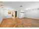 Spacious unfurnished living room featuring hexagon-shaped tile and an open layout at 7703 N Branch Ave, Tampa, FL 33604