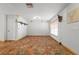 Unfurnished living room displaying hexagon tile floors, and a window at 7703 N Branch Ave, Tampa, FL 33604