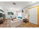 Bright, staged living room featuring neutral furniture and a decorative rug at 7703 N Branch Ave, Tampa, FL 33604