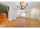 Open layout living room with hexagon tile floors and stairs leading to the upper level at 7703 N Branch Ave, Tampa, FL 33604