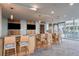 Modern bar area with ample seating, stylish lighting, and multiple TVs for entertainment at 777 N Ashley Dr # 1506, Tampa, FL 33602