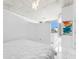 Bright bedroom featuring a minimalistic design, concrete ceilings, with expansive window and city views at 777 N Ashley Dr # 1506, Tampa, FL 33602