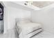 Bright bedroom featuring a minimalistic design with an all-white aesthetic and concrete ceilings at 777 N Ashley Dr # 1506, Tampa, FL 33602
