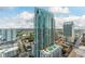 Stunning high-rise building with a pool deck and panoramic views of the cityscape under a bright blue sky at 777 N Ashley Dr # 1506, Tampa, FL 33602