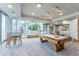Well-lit game room featuring a pool table, comfortable seating, and city views at 777 N Ashley Dr # 1506, Tampa, FL 33602