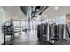 Fully equipped gym with weight machines and views from floor-to-ceiling windows at 777 N Ashley Dr # 1506, Tampa, FL 33602