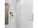 Hallway featuring a storage closet, white walls and marble floors leading to apartments at 777 N Ashley Dr # 1506, Tampa, FL 33602