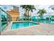 Inviting hot tub with clear blue water on a rooftop, enclosed by glass panels, with palm trees visible around at 777 N Ashley Dr # 1506, Tampa, FL 33602