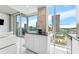 Modern kitchen with center island, white cabinets, and stainless appliances featuring expansive windows and city views at 777 N Ashley Dr # 1506, Tampa, FL 33602