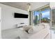 Bright living room featuring marble floors, modern fixtures, a large TV and a balcony with a city view at 777 N Ashley Dr # 1506, Tampa, FL 33602