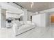 Open-concept living area, showcasing the kitchen with a breakfast bar, an adjacent white living area, and marble floors at 777 N Ashley Dr # 1506, Tampa, FL 33602