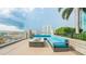 Cozy rooftop lounge area with comfortable turquoise seating and a modern fire pit, offering city views at 777 N Ashley Dr # 1506, Tampa, FL 33602