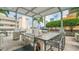 Outdoor kitchen featuring a gas grill, cooking space, and bar-stool seating, perfect for outdoor entertaining at 777 N Ashley Dr # 1506, Tampa, FL 33602