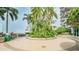 Landscaped rooftop garden area featuring palm trees, green plants, and outdoor seating for entertaining at 777 N Ashley Dr # 1506, Tampa, FL 33602