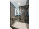 Elegant glass-enclosed shower with black marble tile and modern fixtures at 777 N Ashley Dr # 1506, Tampa, FL 33602