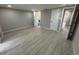 Spacious bedroom with sleek plank floors at 7831 Fox Hollow Dr, Port Richey, FL 34668