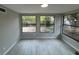 Bright sunroom with backyard views and plank floors at 7831 Fox Hollow Dr, Port Richey, FL 34668