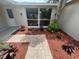 Charming front entry with beautiful stone pathway and well maintained flower beds at 7831 Fox Hollow Dr, Port Richey, FL 34668