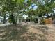 Charming single-story home featuring beautiful landscaping and mature shade trees at 7831 Fox Hollow Dr, Port Richey, FL 34668