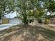 Charming single-story home with large front yard and beautiful mature shade trees at 7831 Fox Hollow Dr, Port Richey, FL 34668