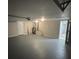 Spacious two car garage is well-lit and freshly painted at 7831 Fox Hollow Dr, Port Richey, FL 34668