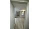 Hallway with hard surface floors leads to the living room at 7831 Fox Hollow Dr, Port Richey, FL 34668