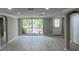Bright and airy living room with neutral colors and large windows offering a pleasant view at 7831 Fox Hollow Dr, Port Richey, FL 34668
