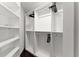 Walk-in closet with custom shelving and ample storage space at 7911 N Packwood Ave, Tampa, FL 33604
