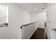 Bright hallway with hardwood floors and natural light from the window at 7911 N Packwood Ave, Tampa, FL 33604