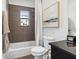 Cozy bathroom featuring a shower over tub, a stylish vanity, and modern fixtures at 820 2Nd N Ave, St Petersburg, FL 33701