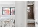 View of bathroom with tub and bedroom with bench and lots of light at 820 2Nd N Ave, St Petersburg, FL 33701