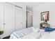 Minimalist bedroom featuring a comfortable bed with sliding door closet and ensuite bath with barn door at 820 2Nd N Ave, St Petersburg, FL 33701