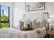 Comfortable bedroom with a queen bed, stylish décor, and lots of natural light at 820 2Nd N Ave, St Petersburg, FL 33701