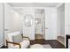 Comfortable bedroom with chair and access to an ensuite bathroom at 820 2Nd N Ave, St Petersburg, FL 33701