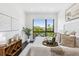 Bright bedroom featuring a comfortable bed with stylish decor, lots of natural light and a view of the city at 820 2Nd N Ave, St Petersburg, FL 33701
