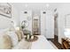 Comfortable bedroom with calming neutral tones, plush bedding, ensuite access, and modern decor at 820 2Nd N Ave, St Petersburg, FL 33701