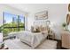 Bright bedroom with a large window showcasing city views, neutral tones, and stylish furnishings at 820 2Nd N Ave, St Petersburg, FL 33701