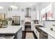Bright kitchen boasts stainless steel appliances, white cabinetry, and center island with seating at 820 2Nd N Ave, St Petersburg, FL 33701