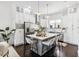 Bright kitchen boasts stainless steel appliances, white cabinetry, and center island with seating at 820 2Nd N Ave, St Petersburg, FL 33701