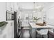 Bright kitchen boasts stainless steel appliances, white cabinetry, and center island with seating at 820 2Nd N Ave, St Petersburg, FL 33701
