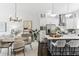 Bright, modern kitchen featuring stainless steel appliances, white cabinets, and a center island with seating at 820 2Nd N Ave, St Petersburg, FL 33701