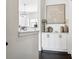 Pass through to a white kitchen with modern decor at 820 2Nd N Ave, St Petersburg, FL 33701